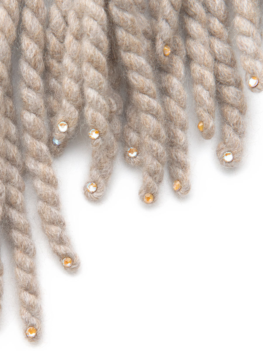 Detail view of Chanterelle or beige colored fringe with crystals on the ends. Constellation Poncho made by Elyse Allen Textiles.