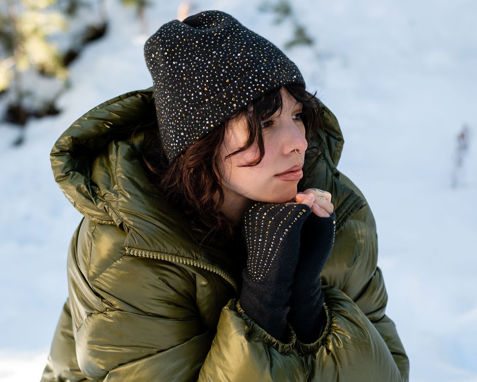 Model wearing a dark green cashmere Estrella Cloche and Estrella Fingerless Gloves. editorial-image