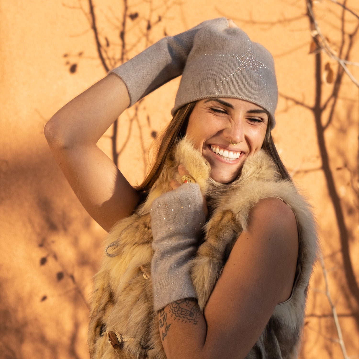 Model wearing cashmere Star Cloche in the color Chanterelle by Elyse Allen Textiles. editorial-image