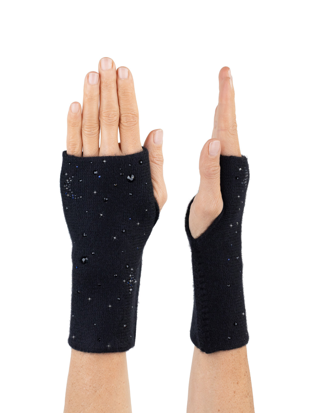 Black fingerless gloves with galaxy crystal pattern worn on a white background