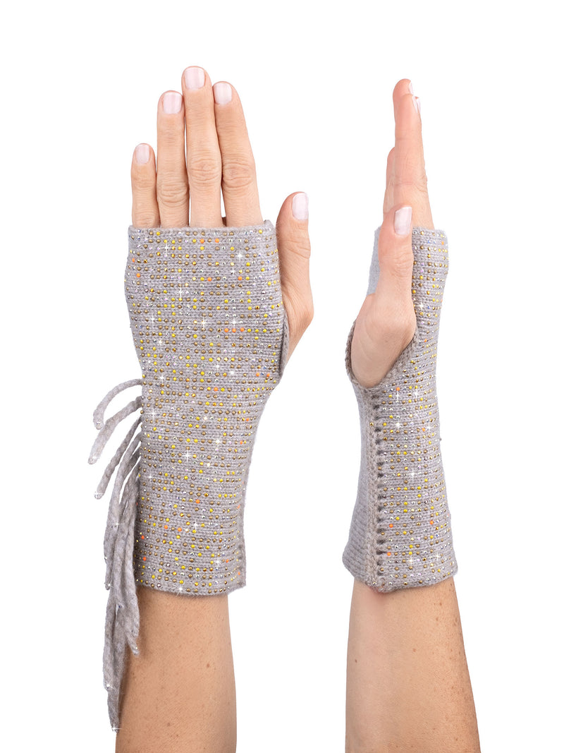 Luxury cashmere gloves fully covered in crystals and metal rhinestuds with fringe on the outer side of the glove. Fingerless gloves by Elyse Allen Textiles shown in the color Chanterelle.