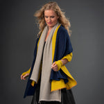 Model showcasing Grey Opal, Turmeric, and Indigo Crystal embellished shawls by Elyse Allen Textiles. editorial-image