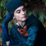 Tourmaline Dragon Cloche editorial-image. Model wearing luxury winter accessories by Elyse Allen Textiles.