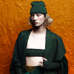editorial-image for forest green colored Estrella Shawl embellished with luxury Austrian crystals and finished with a scalloped edge.