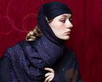 editorial-image for plum colored Estrella Shawl embellished with luxury Austrian crystals and finished with a scalloped edge.
