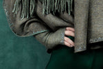 Close up view of Sage colored Featherweight Triangle Gloves. editorial-image