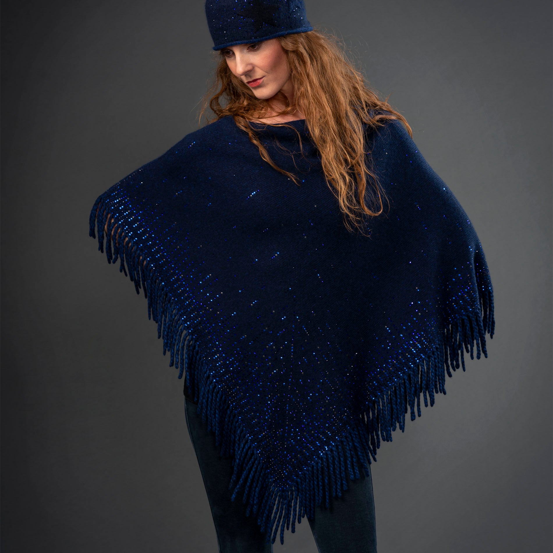 Lattice Fringe Poncho editorial-image shown in Indigo.