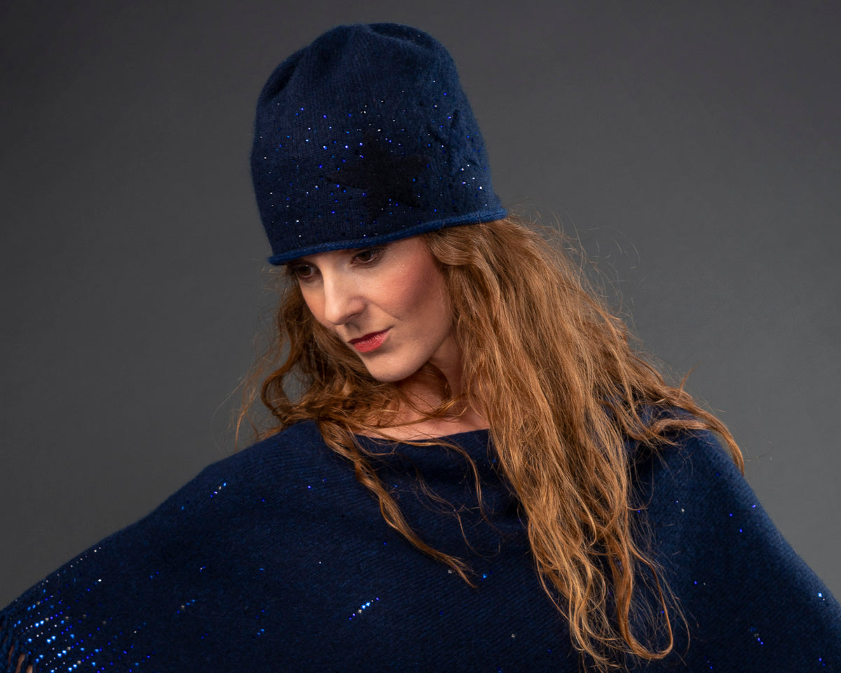 Model wearing Indigo colored Star Applique hat by Elyse Allen Textiles. editorial-image