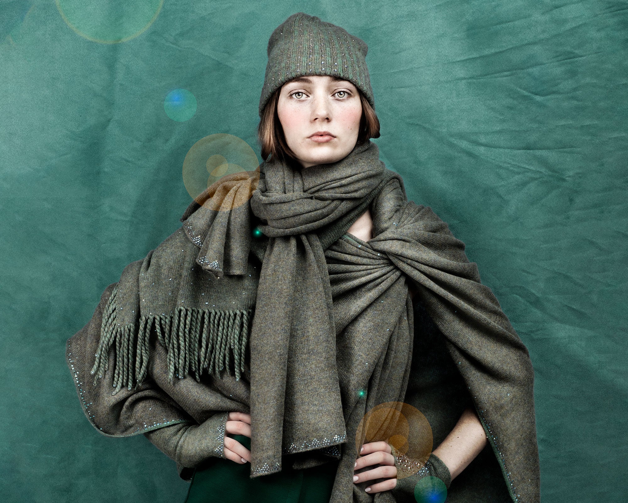 Model wearing Sage Triangle Tissue Weight Shawl. editorial-image