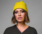 Model wearing Turmeric Fairisle Hat by Elyse Allen Textiles. editorial-image