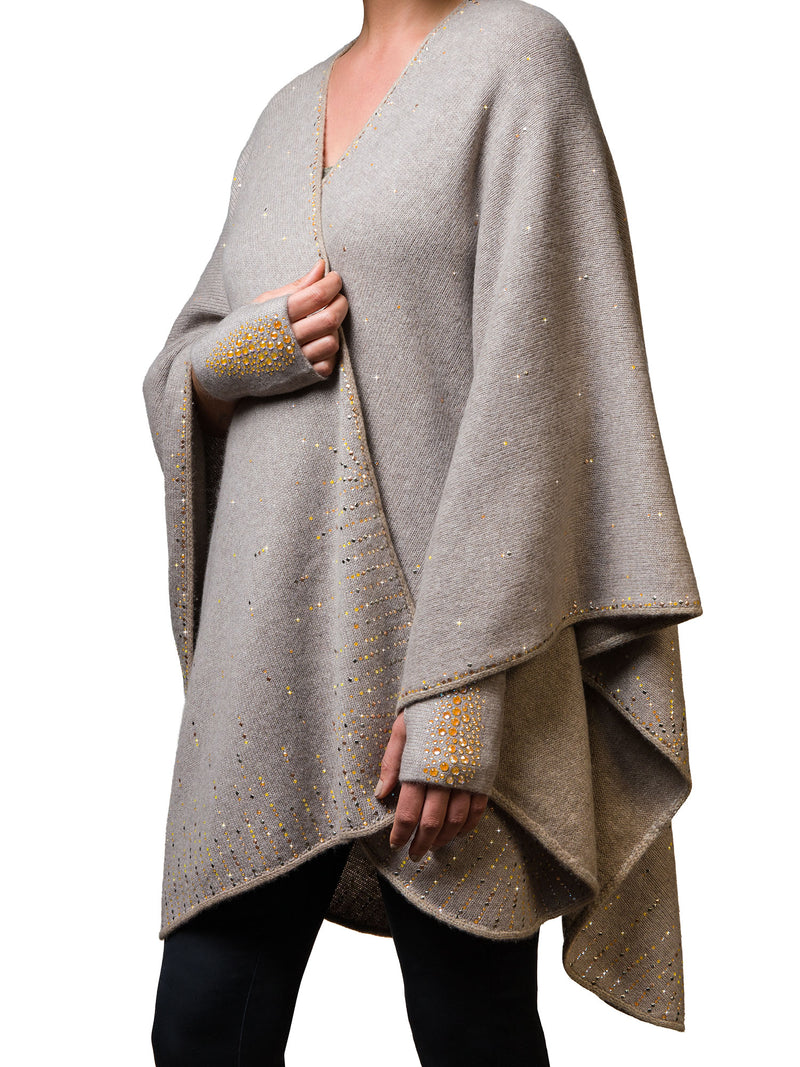 Chanterelle or tan colored cashmere Ruana Cape worn by a model with sparkly fingerless gloves.