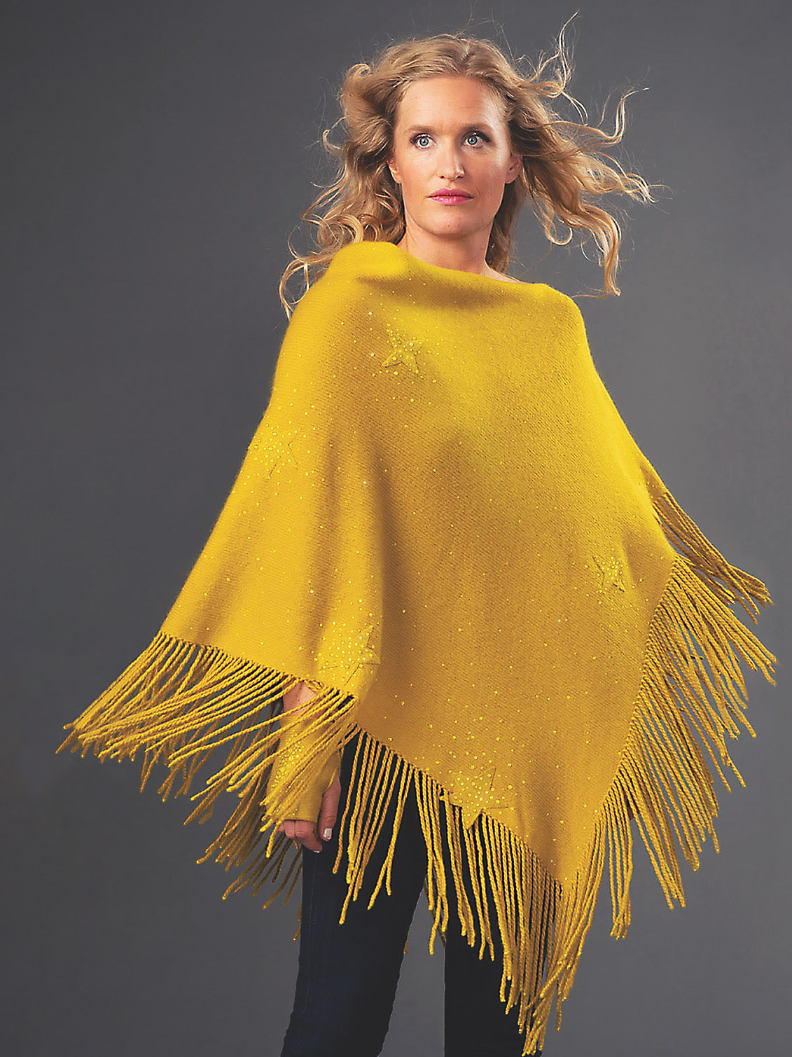 Model wearing Turmeric colored Star Poncho.