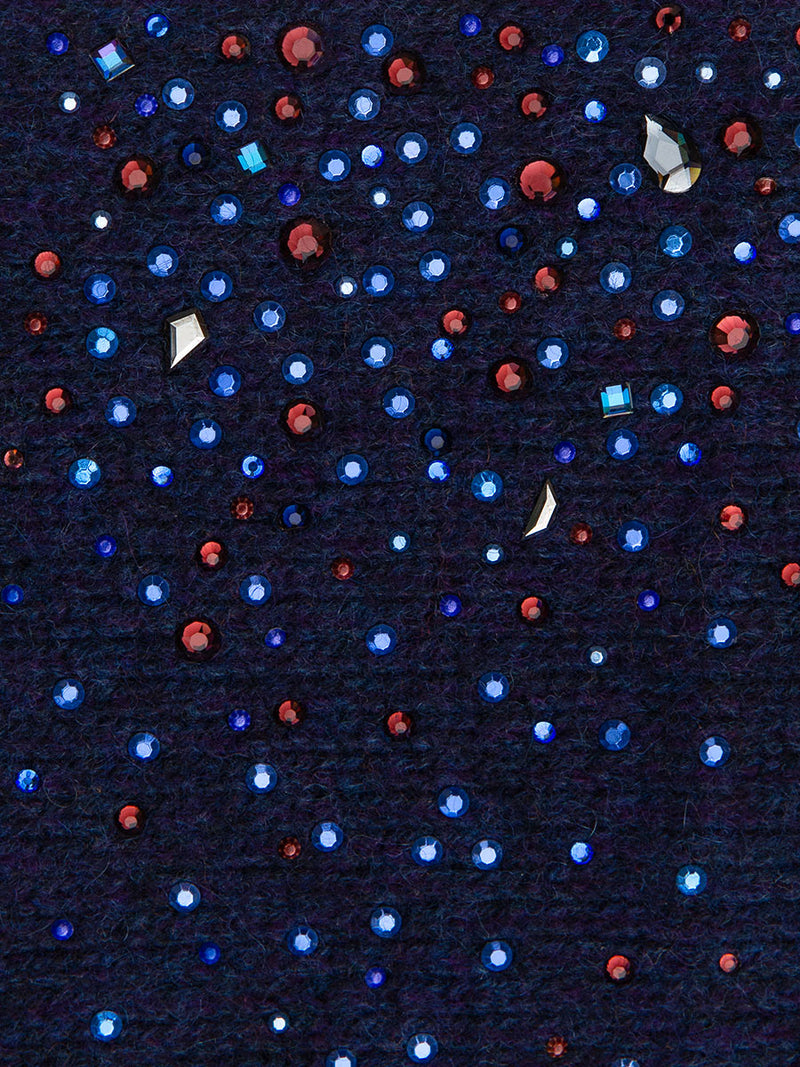 Plum fabric swatch close up for Starry Night Featherweight Gloves. Red and blue crystal details.