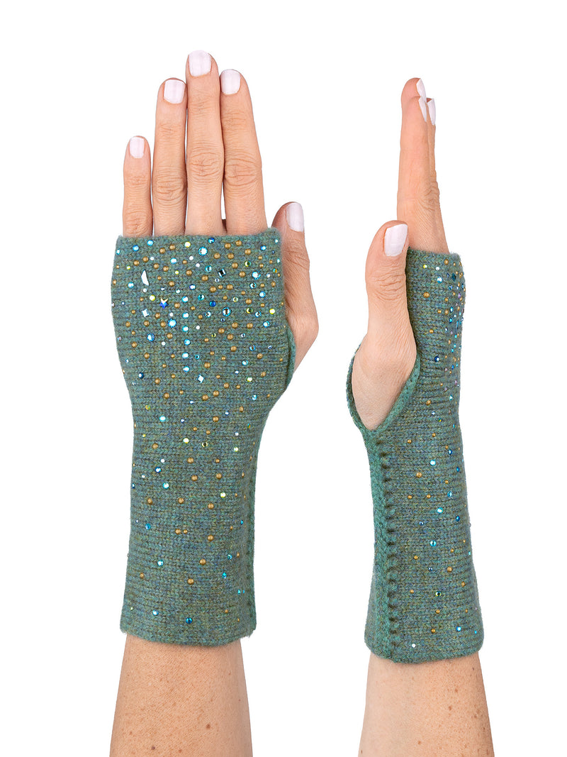 A pair of green, fingerless gloves adorned with encrusted crystals and rhinestones with a Starry Night pattern.