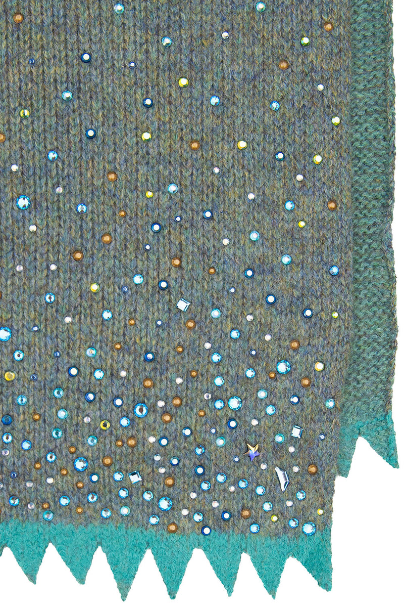 Sage colored cashmere fabric swatch for Starry Night Shawl, showing the bottom corner.