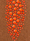 Chestnut colored cashmere fabric swatch showing orange crystals embellishment.